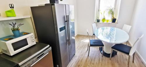 Kuchyň nebo kuchyňský kout v ubytování Chillax Rooms