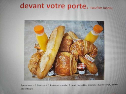 a poster of a bunch of bread and croissants at Studios du Cèdre in Cuvilly