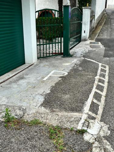 an empty parking lot next to a gate at Studio i Apartman Ema in Rijeka