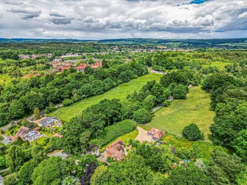 an aerial view of a park with trees and houses at Charming Annexe Lodge with Parking Pass The Keys in Midhurst