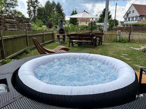 a large pool of water sitting on a table in a yard at Apartment Frushi by Interhome in Großschönau