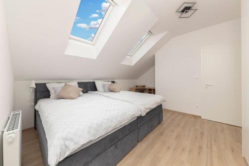 a bedroom with a large bed in a attic at Apartment Božica in Ljubljana