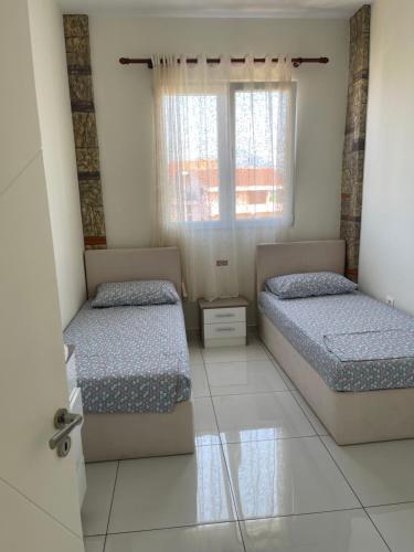 Postel nebo postele na pokoji v ubytování Franco Apartments