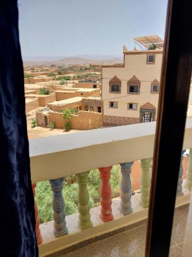 a view of a city from a balcony at Sud Est Palace in Aït Ridi