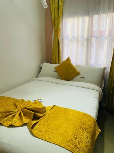 Giường trong phòng chung tại SR Apartments DSQ