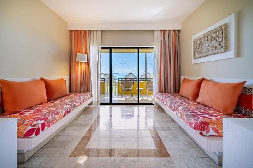a hotel room with two beds and a balcony at Iberostar Waves Quetzal - All Inclusive in Playa del Carmen