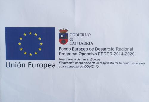 a sign for the european parliament with a flag at Casa Miguel in Olea