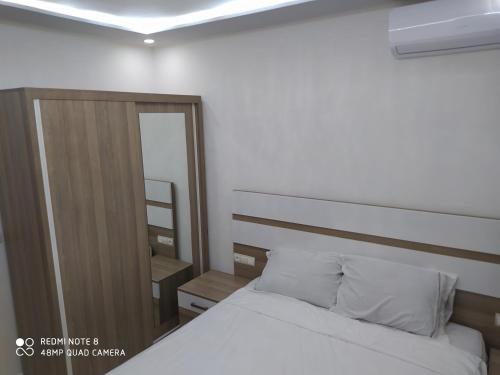 Кровать или кровати в номере Hay al matar, Nador de luxe