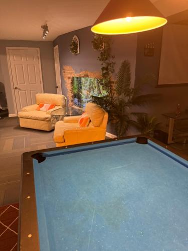 a living room with a large pool in the middle of a room at Charming, Restful Getaway in Bushkill