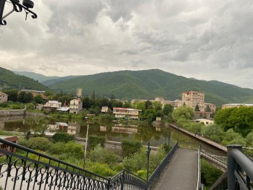 a view of a town with a river and mountains at Eco Art House in Vanadzor