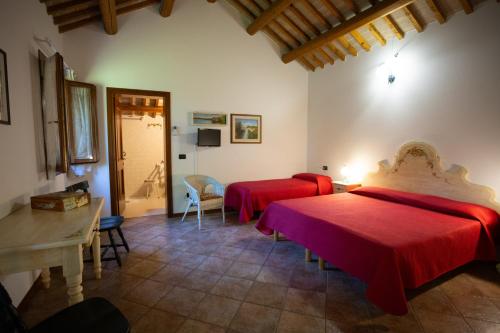 Postel nebo postele na pokoji v ubytování Agriturismo Zennare