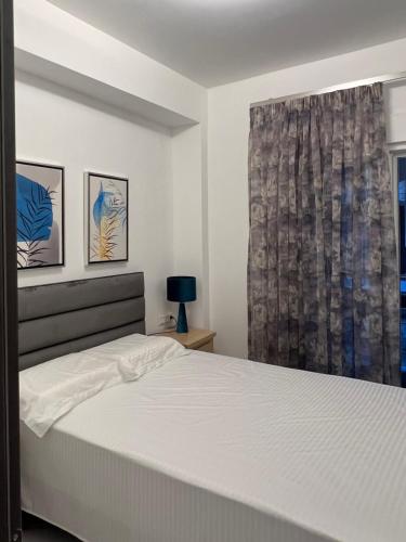 Ένα ή περισσότερα κρεβάτια σε δωμάτιο στο Seafront Lux Apartment