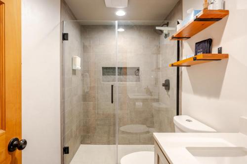 a bathroom with a shower with a toilet and a sink at Der Steiermark Unit 108 - Cozy King Studio Off Main St & Peak 9 Base w AC, Balcony, Shared Hot Tub & Free Parking - No Fireplace in Breckenridge