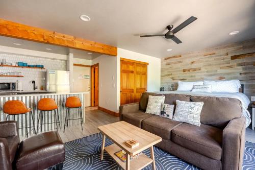 a living room with a couch and a bed at Der Steiermark Unit 108 - Cozy King Studio Off Main St & Peak 9 Base w AC, Balcony, Shared Hot Tub & Free Parking - No Fireplace in Breckenridge