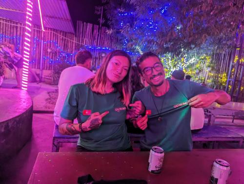 a man and a woman posing for a picture at a table at OG Homes in Ha Giang