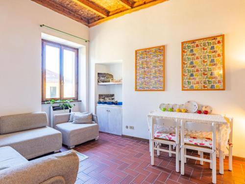 a living room with a couch and a table at Apartment Viola by Interhome in Gravedona