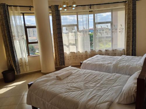 Ένα ή περισσότερα κρεβάτια σε δωμάτιο στο Jsons Sapphire