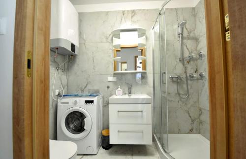 Ένα μπάνιο στο Apartament Muszelka 27