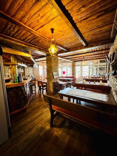 a large room with tables and a ping pong table at Vila Relax in Dobra Voda