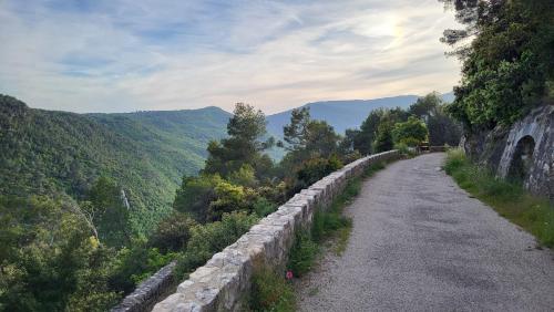 a stone wall on the side of a road at Bastide de Nartas in Tourrettes-sur-Loup
