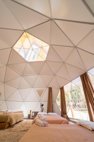 Una cama o camas en una habitación de Glamping Miraflores