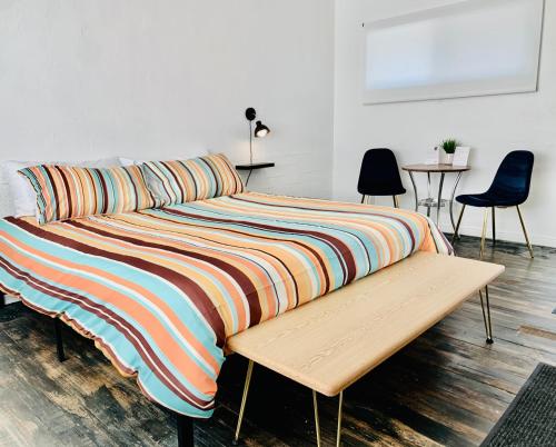 Ένα ή περισσότερα κρεβάτια σε δωμάτιο στο Dragonfly Motor Lodge
