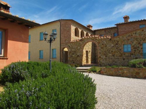 an old stone building with a street light in front at Apartment Cipresso by Interhome in Osteria Delle Noci