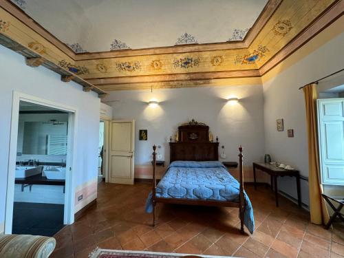 a bedroom with a bed in a room with a ceiling at Villa Dell'Annunziata in Rieti