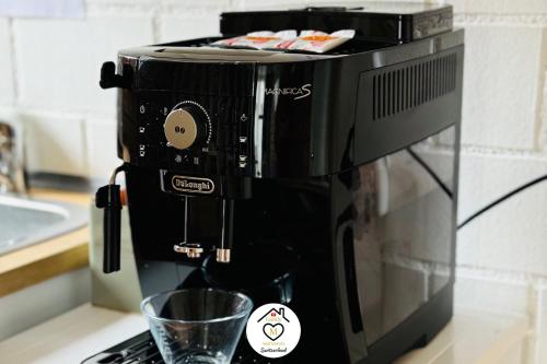 a coffee maker sitting on top of a counter at Family M Apartments 1 in Kappel bei Olten