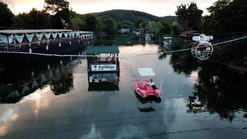 a boat is tied to a dock in a river at Paradise Plus Ağva in Agva
