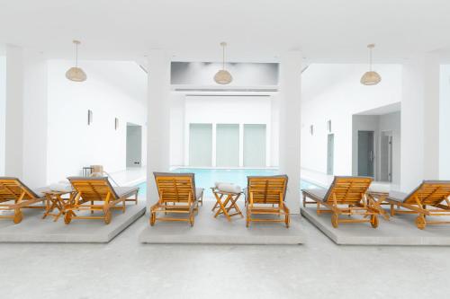 a group of chairs and a table in a room at InterContinental Durrat Al Riyadh Resort & Spa by IHG in Riyadh