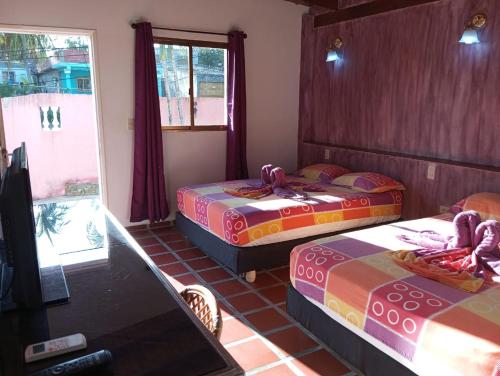 Postel nebo postele na pokoji v ubytování Casa el Pozo Playa el Agua