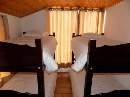 Ein Bett oder Betten in einem Zimmer der Unterkunft Cabañas Refugio del cerro