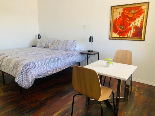 Ένα ή περισσότερα κρεβάτια σε δωμάτιο στο Dragonfly Motor Lodge