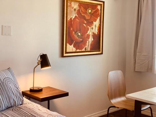 Ένα ή περισσότερα κρεβάτια σε δωμάτιο στο Dragonfly Motor Lodge
