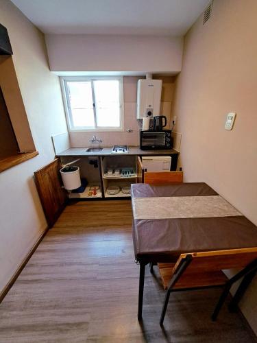 a small kitchen with a table in a room at Tierra Mora in San Rafael