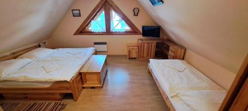 Postel nebo postele na pokoji v ubytování Chaty Helena