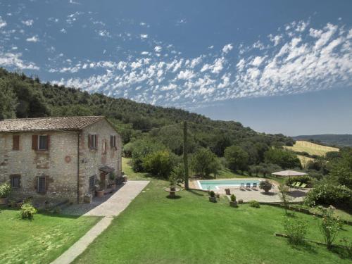 an external view of a house and a swimming pool at Holiday Home Casale Del Re by Interhome in Guadamello