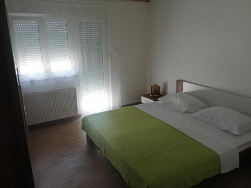 Ένα ή περισσότερα κρεβάτια σε δωμάτιο στο Apartments Kabalin 1