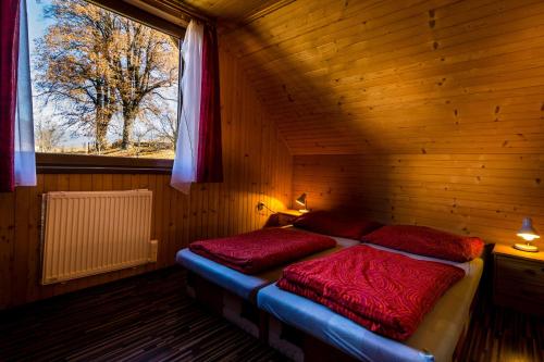Postel nebo postele na pokoji v ubytování chatyliptov v srdci LIPTOVA