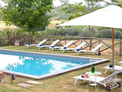 a swimming pool with two planes on top of it at Villa Ghizzano by Interhome in Peccioli
