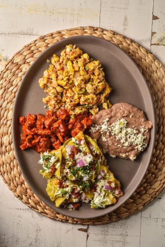 a plate of food with meat and vegetables on a table at Casa Raco - Parras de la Fuente in Parras de la Fuente