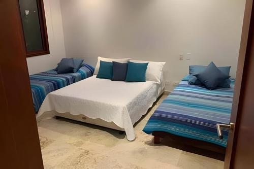 Кровать или кровати в номере 212 Cartagena Walled City Magical Apt