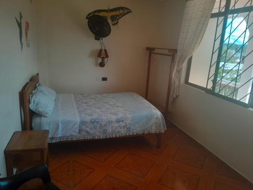 Ein Bett oder Betten in einem Zimmer der Unterkunft Hostal Limoncocha