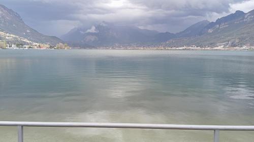 a view of a large body of water with mountains at La Dimora Dei Due Laghi in Calolziocorte