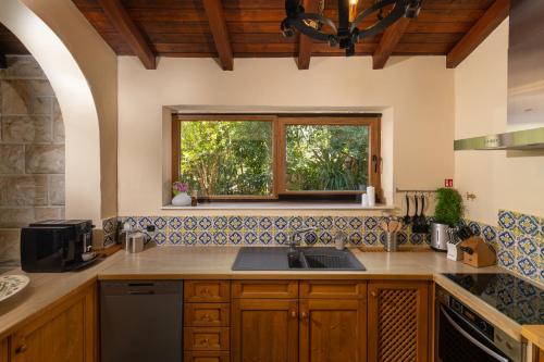 a kitchen with a sink and a window at Villa Gallus - Jelsa, Hvar in Jelsa