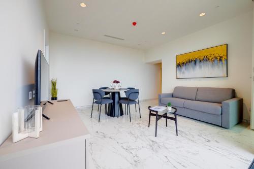 a living room with a couch and a table at Mercury Tower Apartments in St Julian's