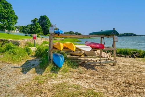 a group of surfboards sitting on the shore of a lake at Walk to 2 Beaches Pocasset Home with Kayaks and Bikes in Pocasset