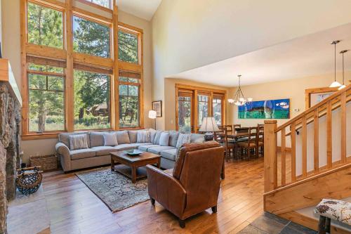 a living room with a couch and a table at Fairway Drive 13151 by East West Hospitality in Truckee
