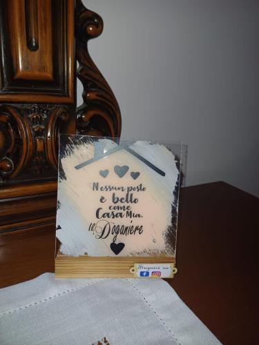a sign sitting on top of a bed at Il Doganiere in Montecchio